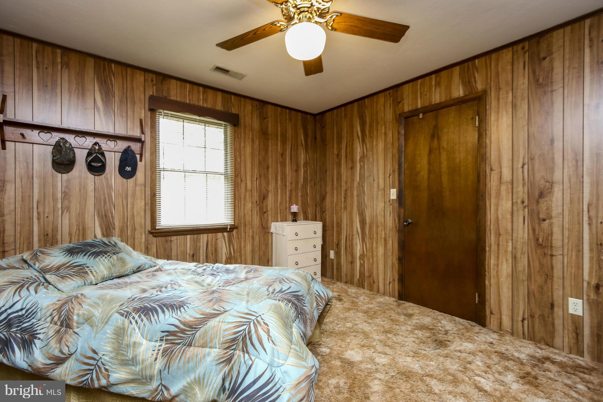 4355 Ruggles Road Taneytown, MD 21787 - Photo 26 of 27 a bedroom with a bed and a chandelier