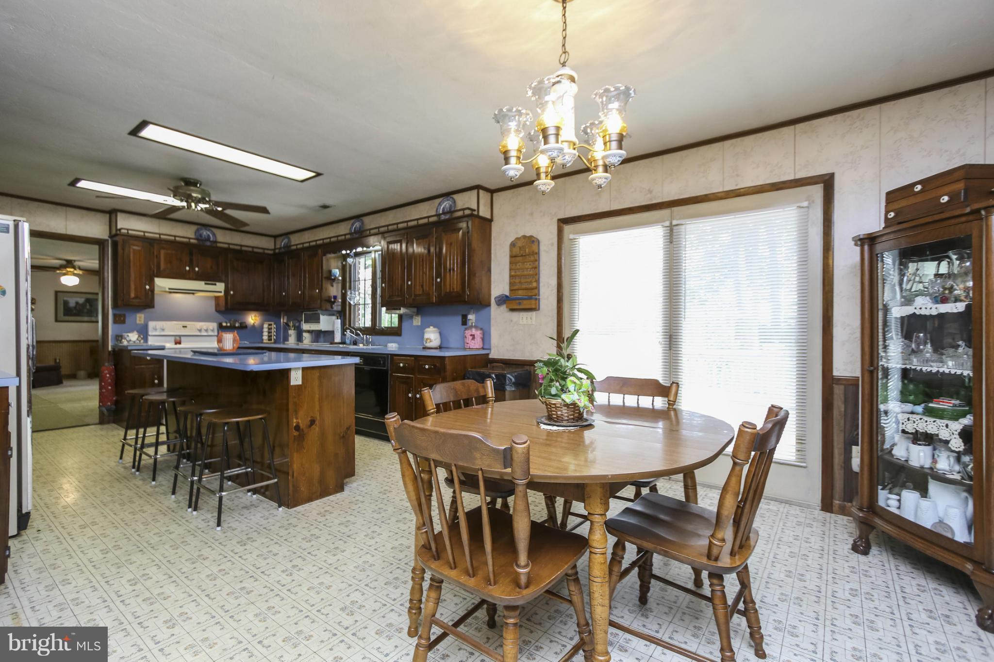 4355 Ruggles Road Taneytown, MD 21787 - Photo 5 of 27 a view of a dining room with furniture and a chandelier