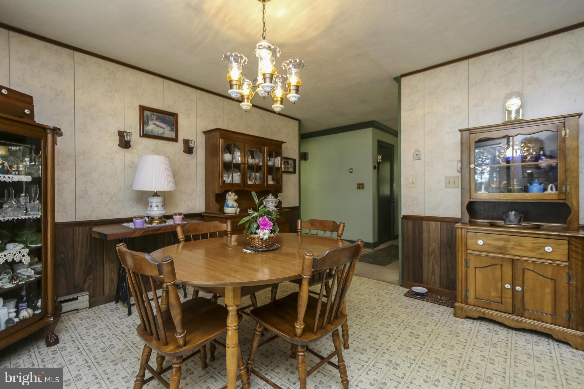 4355 Ruggles Road Taneytown, MD 21787 - Photo 8 of 27 a view of a dining room with furniture and a chandelier