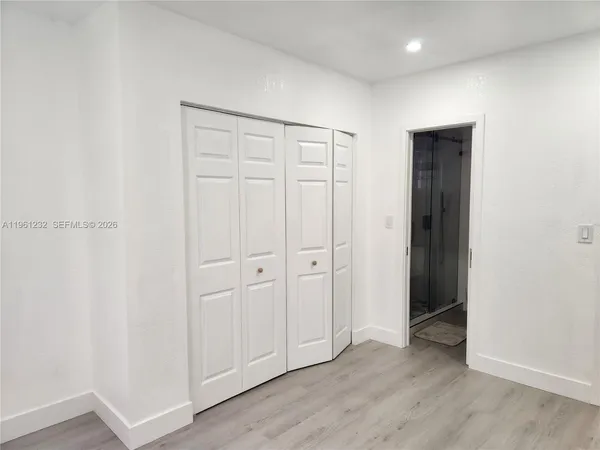 a view of a small space with wooden floor