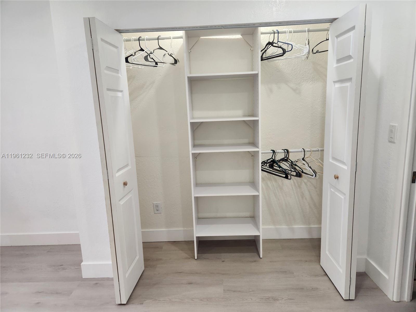 12460 Southwest 187th Terrace, Unit 1 Miami, FL 33177 - Photo 13 of 16 a view of a walk in closet