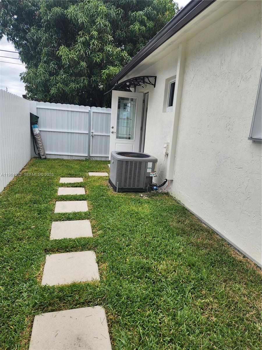 12460 Southwest 187th Terrace, Unit 1 Miami, FL 33177 - Photo 15 of 16 a view of back yard of the house