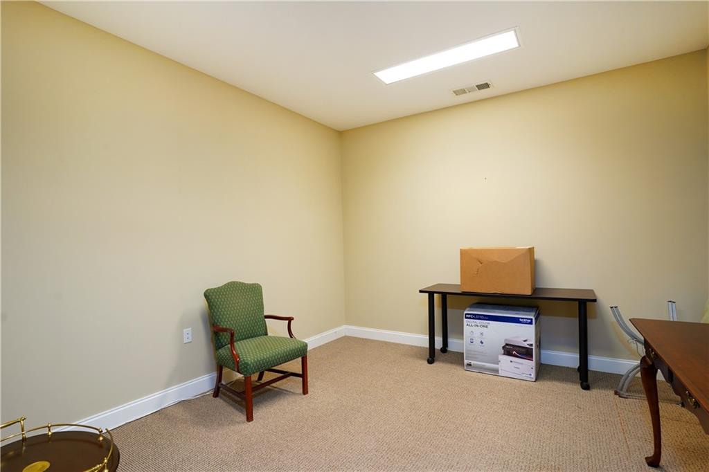 2775 Cruse Road Northwest, Unit 802 Lawrenceville, GA 30044 - Photo 12 of 16 a view of a room with chair and a table in it