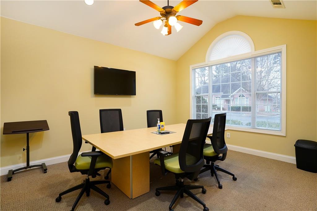 2775 Cruse Road Northwest, Unit 802 Lawrenceville, GA 30044 - Photo 6 of 16 a view of a workspace with furniture and a window