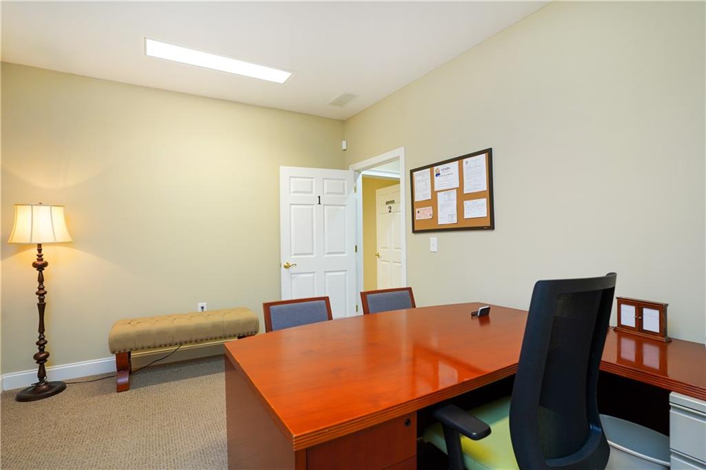 2775 Cruse Road Northwest, Unit 802 Lawrenceville, GA 30044 - Photo 9 of 16 a room with a table and chairs