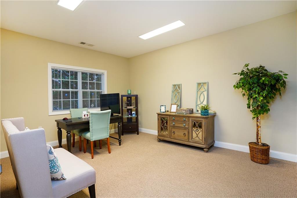 2775 Cruse Road Northwest, Unit 802 Lawrenceville, GA 30044 - Photo 10 of 16 a living room with furniture and a potted plant