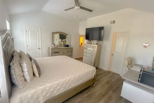 a living room with a bed furniture and a window