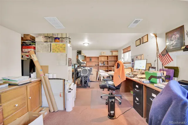 a view of a livingroom with furniture and front door