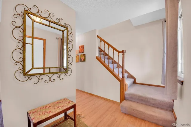 a view of an entryway with wooden floor