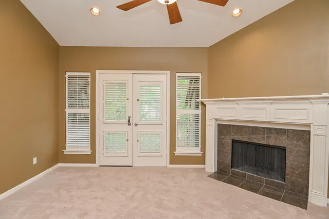 a spacious bathroom with a granite countertop sink and a mirror