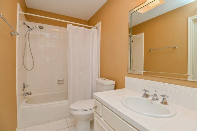 a view of a room with a ceiling fan
