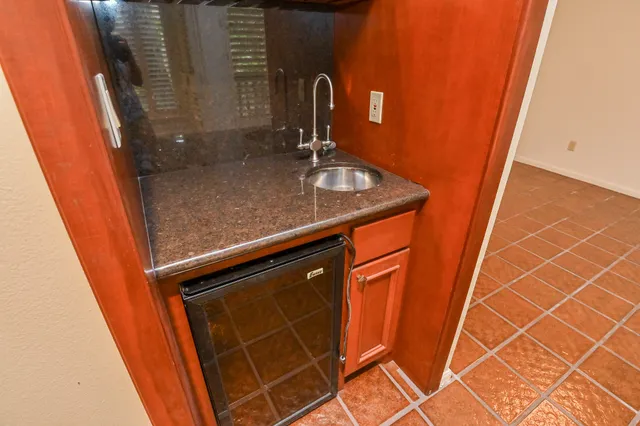a view of a room with a dining table and a window