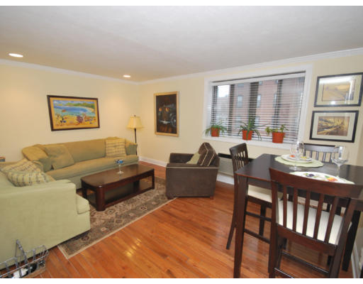 9 Appleton Street, Unit 208 Boston, MA 02116 - Photo 1 of 1 a living room with furniture dining table and a large window