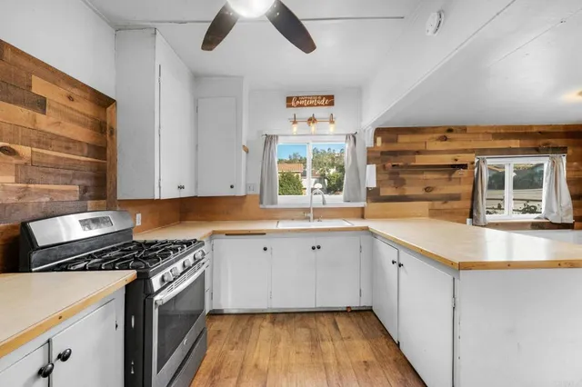 a kitchen with a sink and cabinets