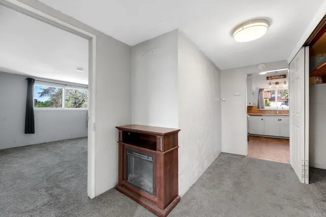 a view of an empty room and window