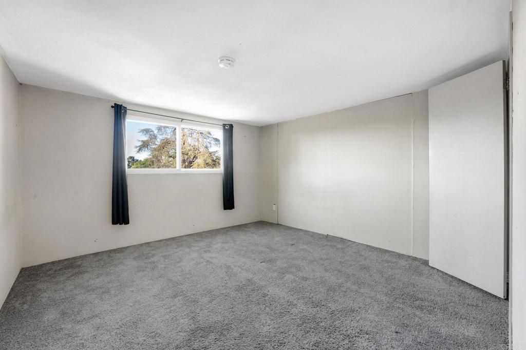 8273 Melrose Lane El Cajon, CA 92021 - Photo 14 of 33 an empty room with windows