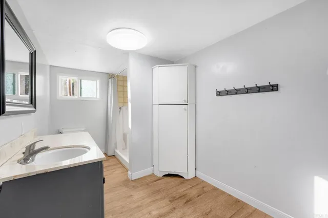 a bathroom with a sink and a mirror