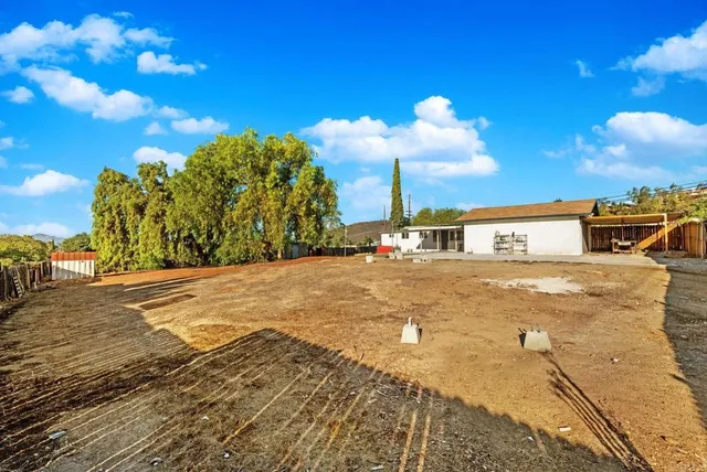 a view of street with large trees