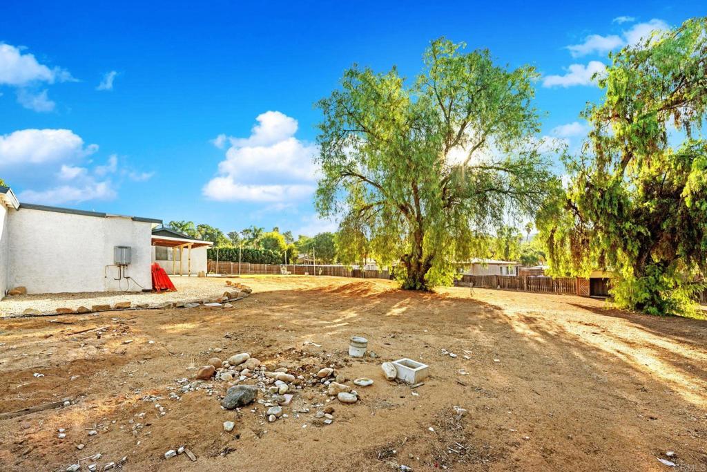 8273 Melrose Lane El Cajon, CA 92021 - Photo 30 of 33 a view of a yard with a house in the background