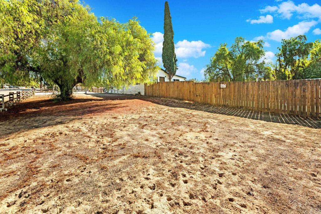 8273 Melrose Lane El Cajon, CA 92021 - Photo 32 of 33 a row of trees with wooden fence