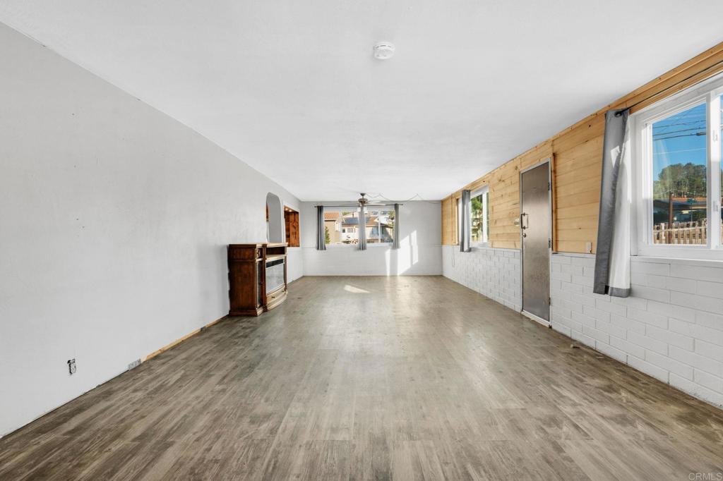 8273 Melrose Lane El Cajon, CA 92021 - Photo 6 of 33 a view of empty room with wooden floor