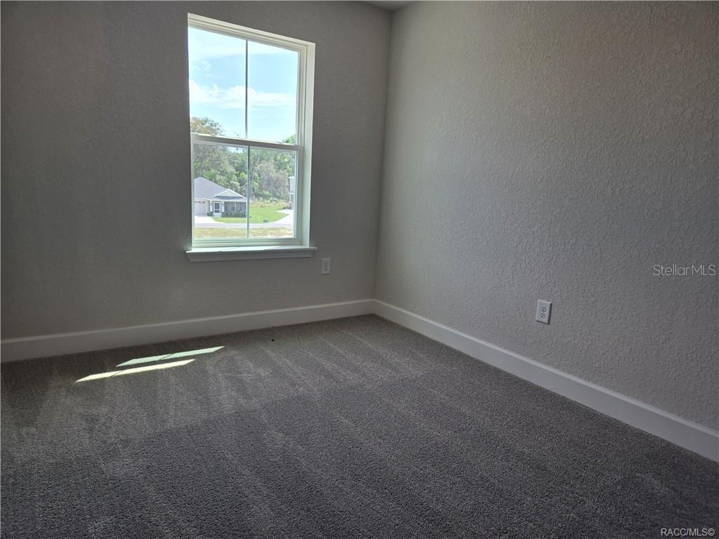 279 Bittern Loop Inverness, FL 34453 - Photo 16 of 30 an empty room with a window