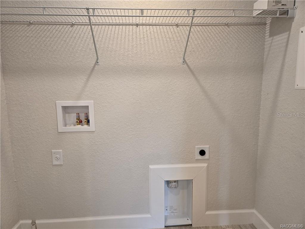 279 Bittern Loop Inverness, FL 34453 - Photo 17 of 30 a view of small space with racks on the wall