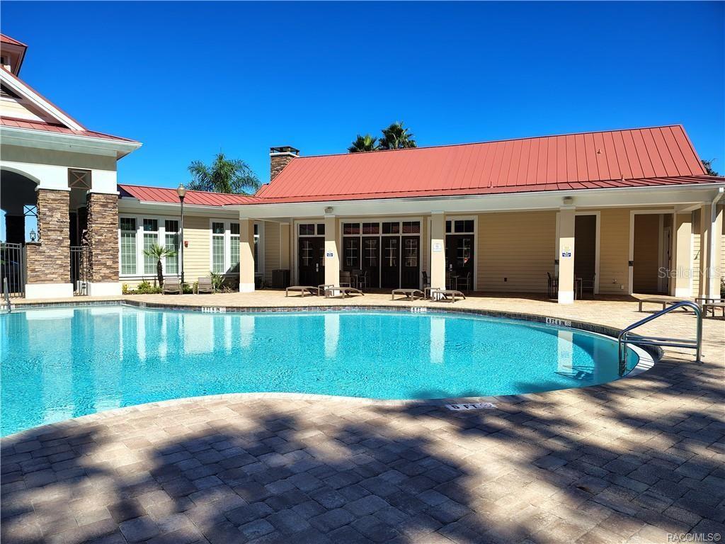 279 Bittern Loop Inverness, FL 34453 - Photo 25 of 30 a view of swimming pool with two chairs in a patio