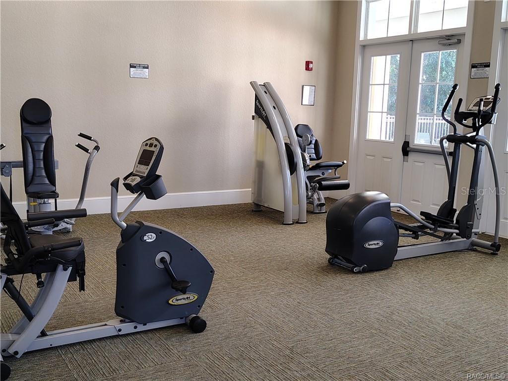 279 Bittern Loop Inverness, FL 34453 - Photo 27 of 30 a view of a room with gym equipment