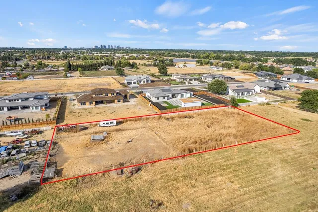 a view of a yard and ocean view