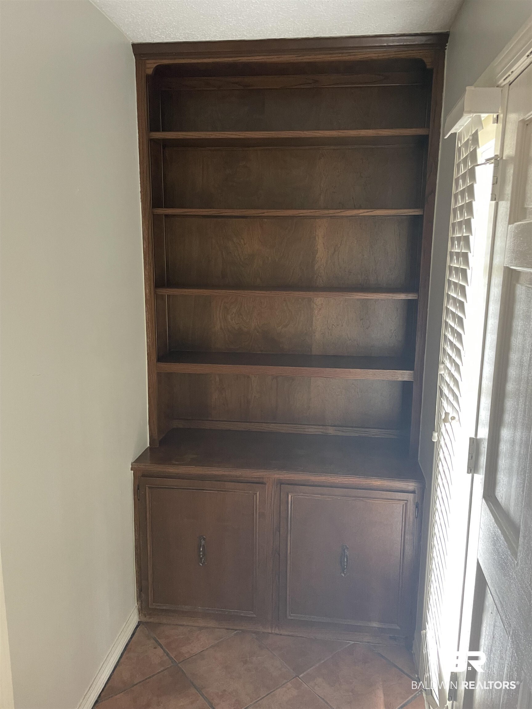 115 Leigh Circle Daphne, AL 36526 - Photo 9 of 12 Built-in cabinet in foyer