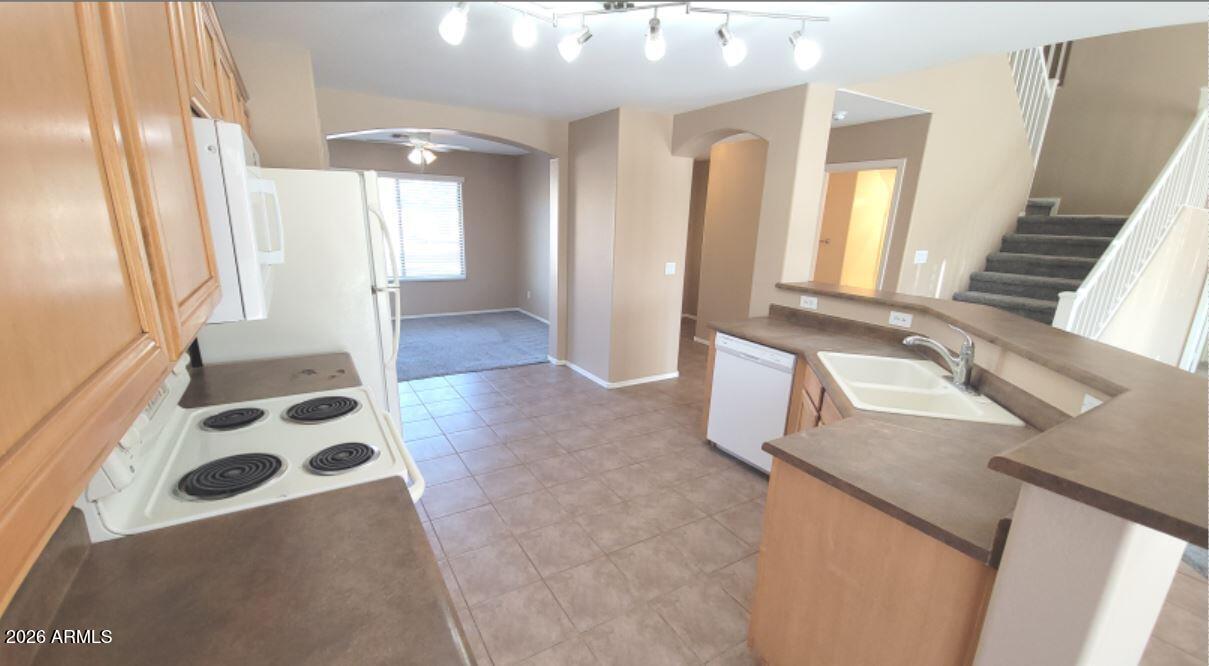 21821 East Via Del Rancho Queen Creek, AZ 85142 - Photo 14 of 35 a bathroom with a sink a mirror and a shower