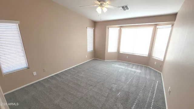 a spacious bathroom with a tub and shower