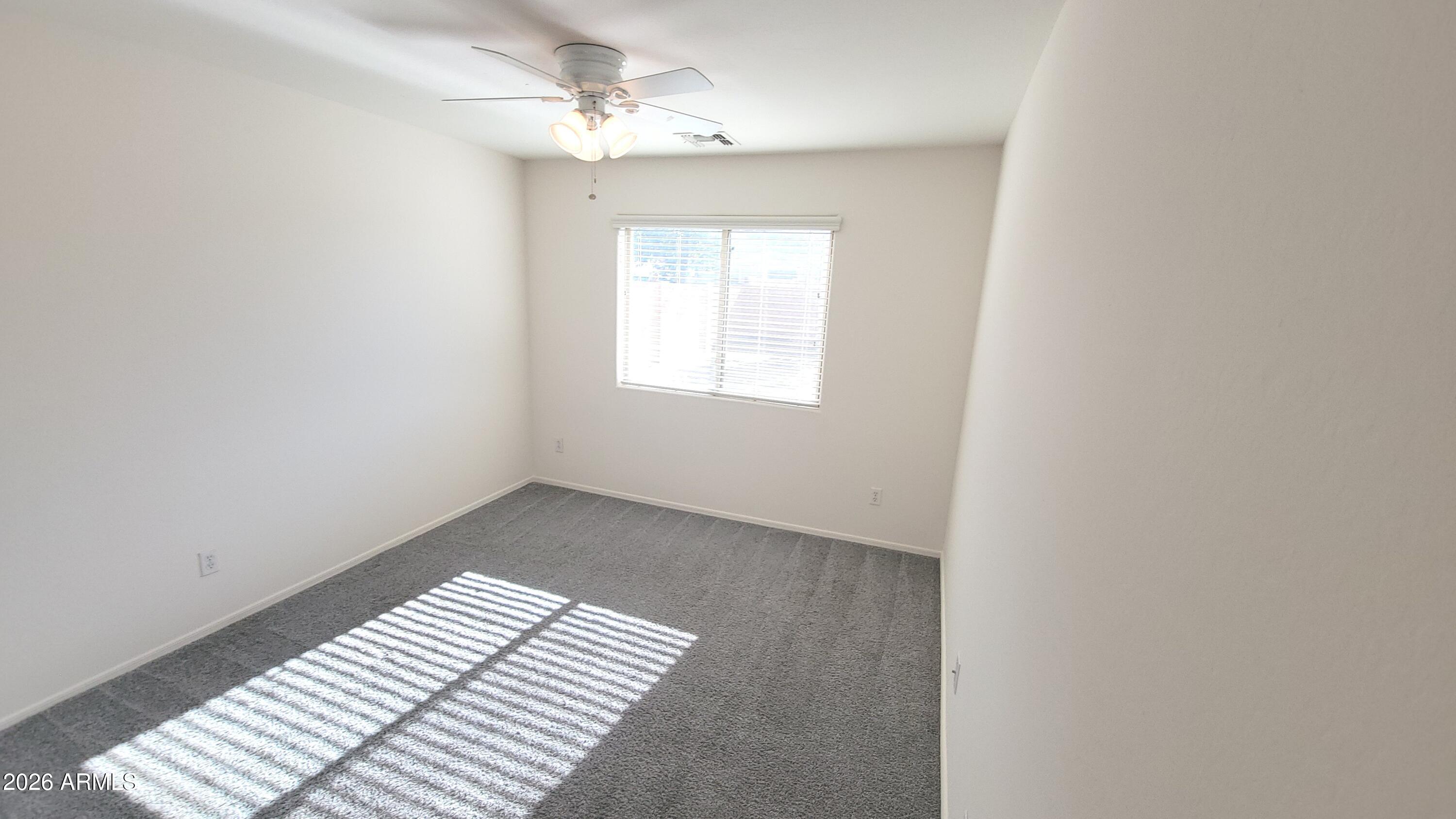 21821 East Via Del Rancho Queen Creek, AZ 85142 - Photo 25 of 35 an empty room with windows