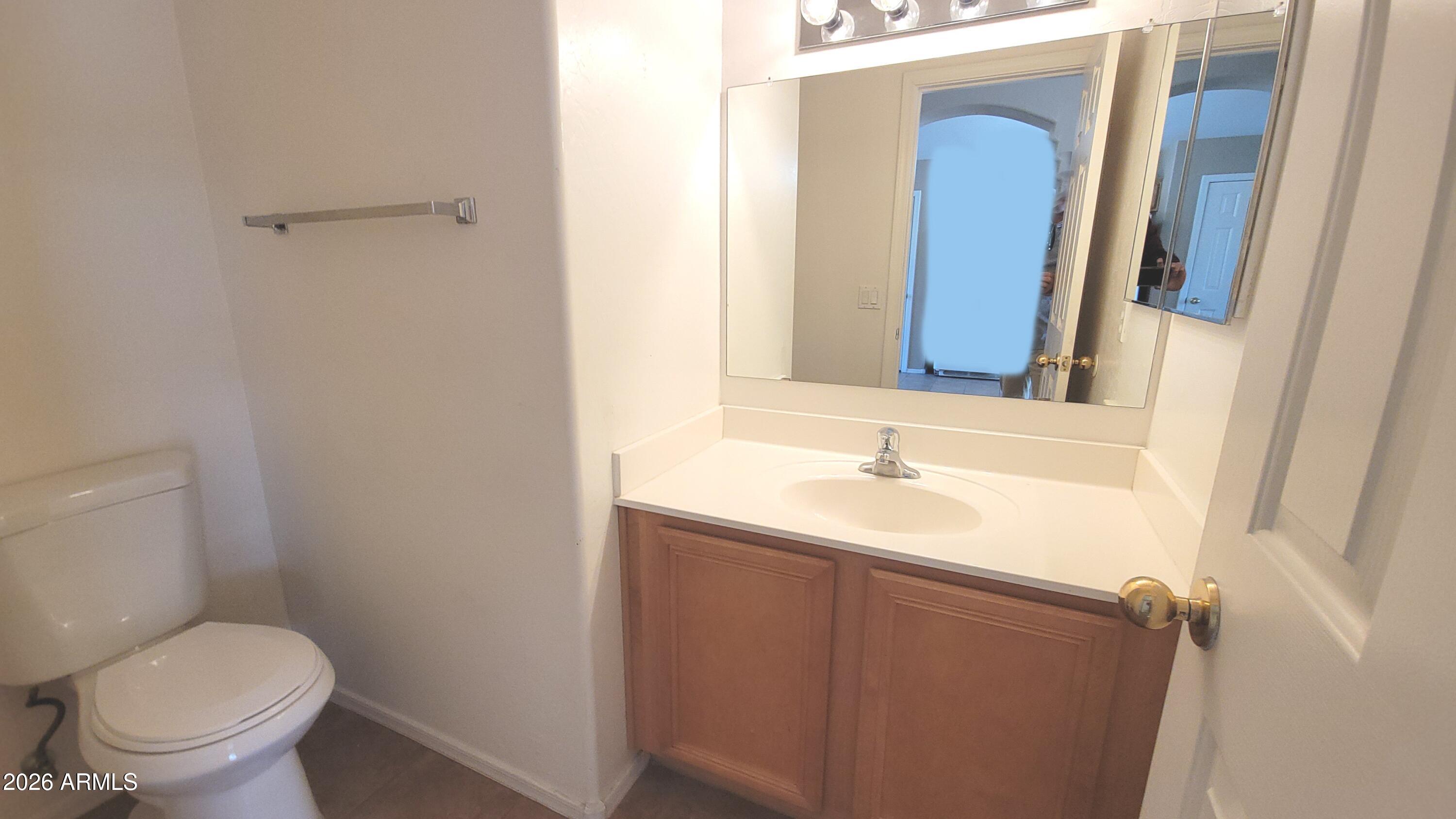 21821 East Via Del Rancho Queen Creek, AZ 85142 - Photo 28 of 35 a bathroom with a sink and a toilet
