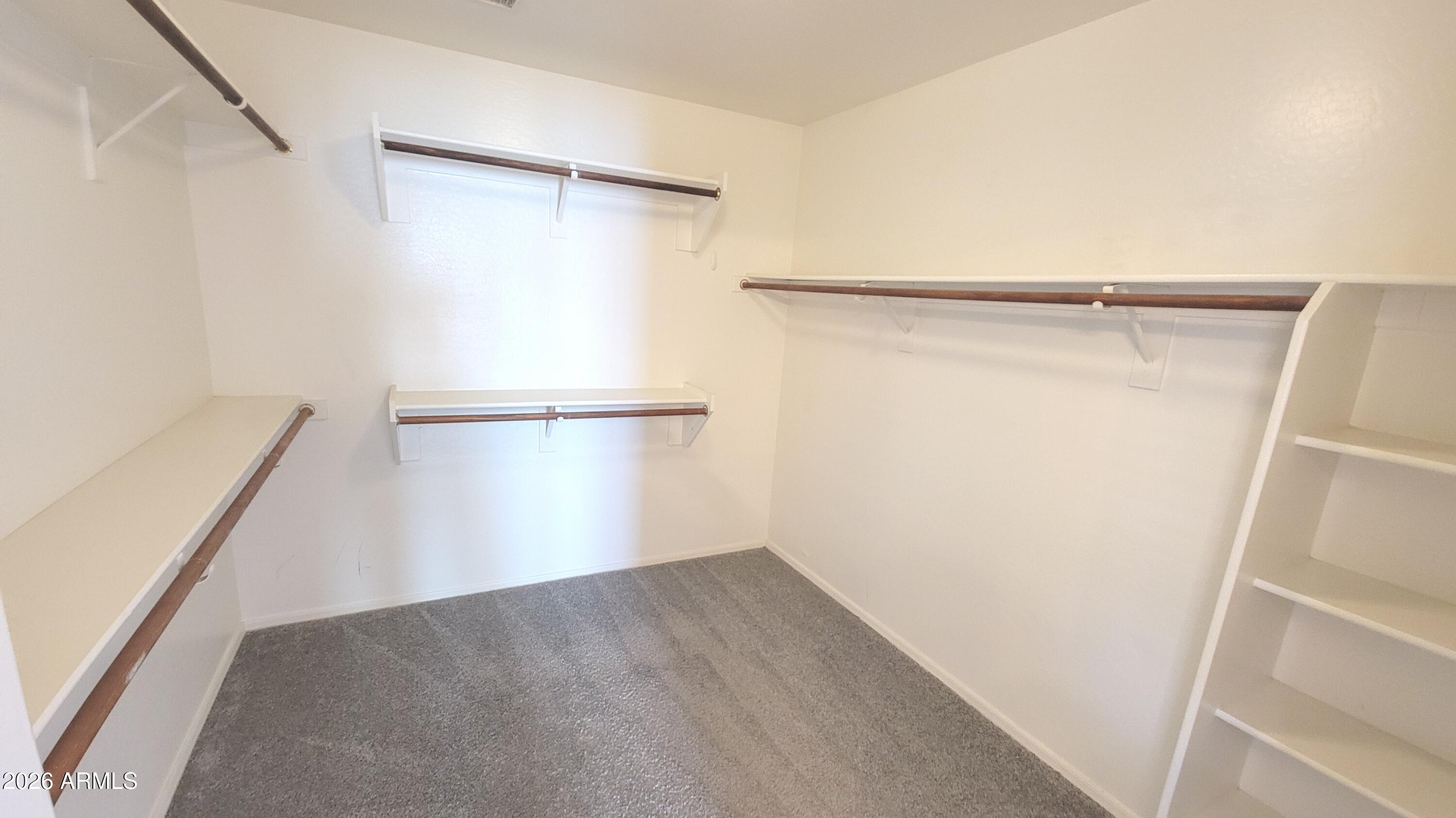 21821 East Via Del Rancho Queen Creek, AZ 85142 - Photo 30 of 35 a view of an empty walk in closet