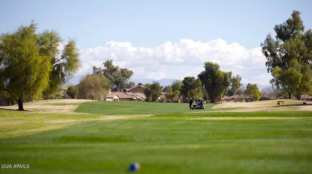 a view of a swimming pool with a patio