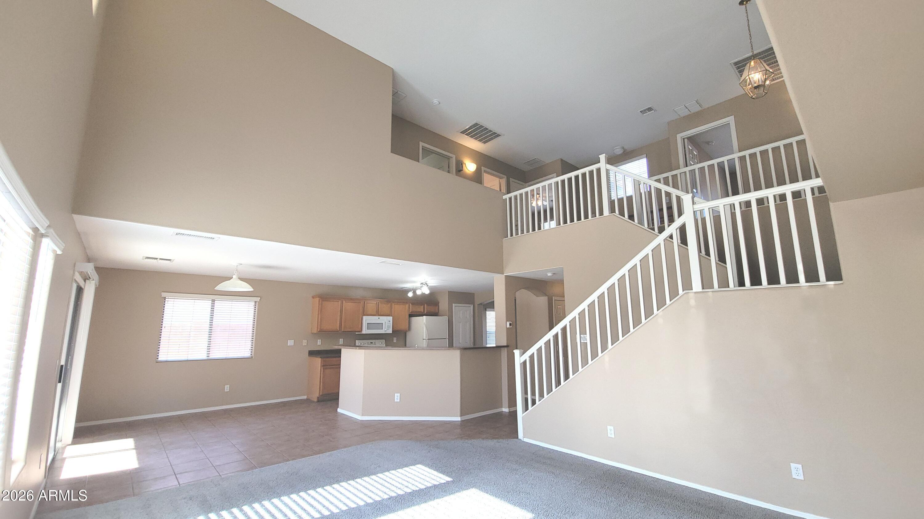 21821 East Via Del Rancho Queen Creek, AZ 85142 - Photo 4 of 35 a view of entryway and hall with wooden floor