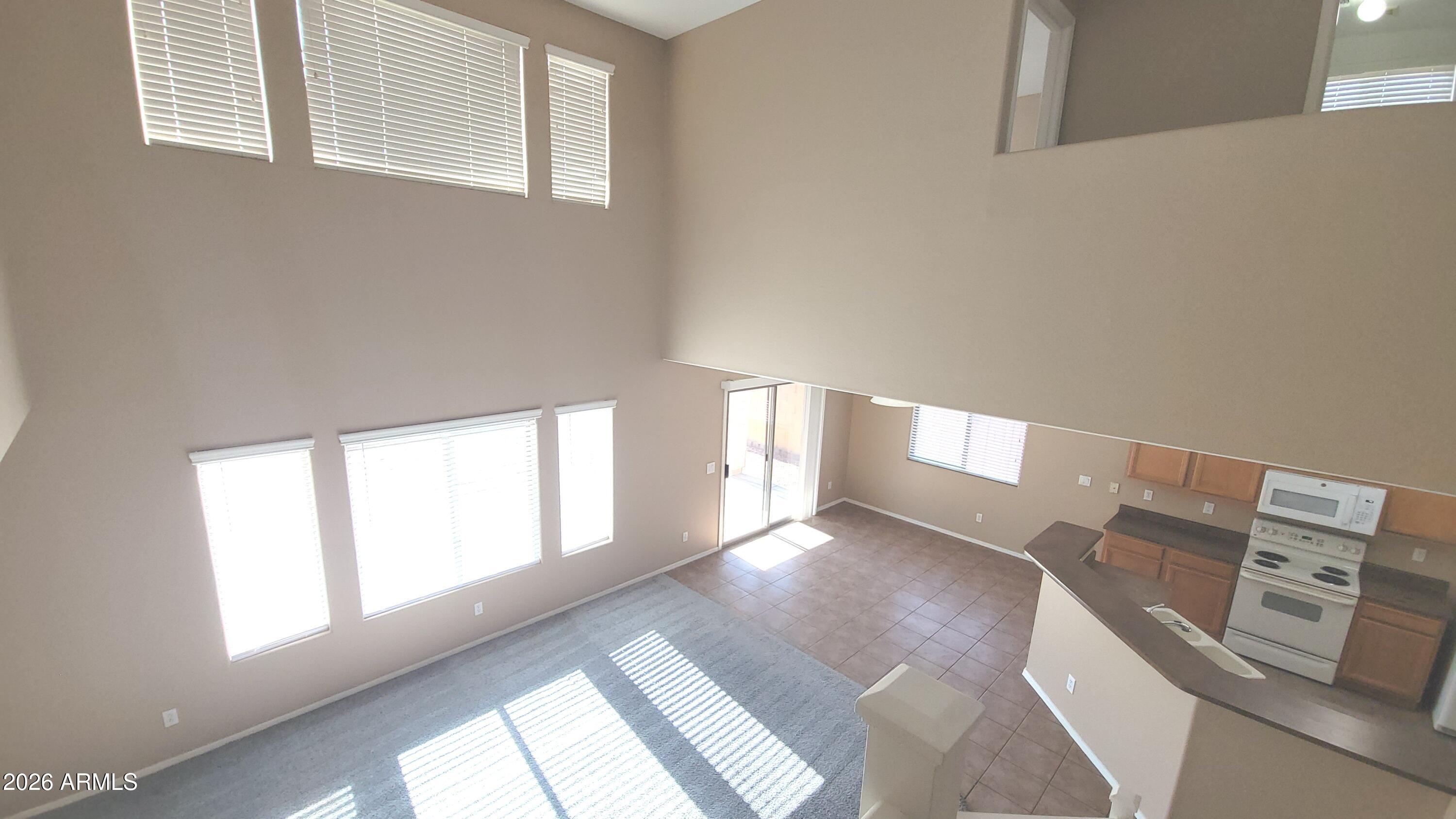 21821 East Via Del Rancho Queen Creek, AZ 85142 - Photo 5 of 35 a view of an empty room with windows
