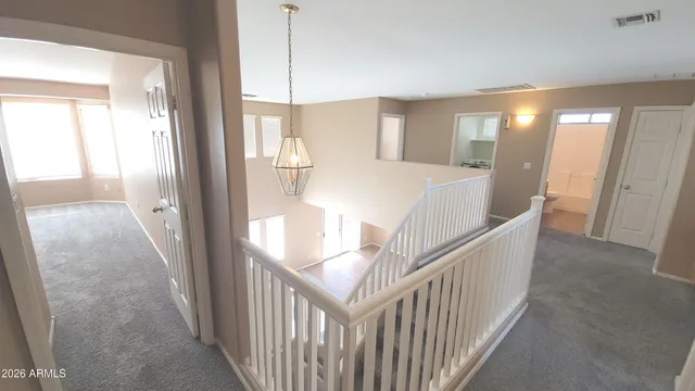 a view of a hallway with windows