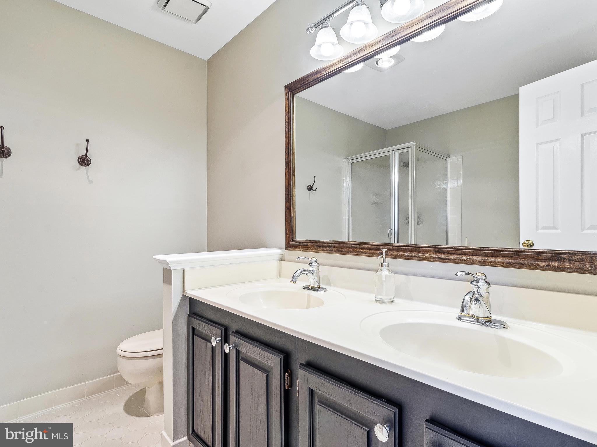 11705 Great Owl Circle Reston, VA 20194 - Photo 18 of 38 Master bathroom with dual sinks & large mirror