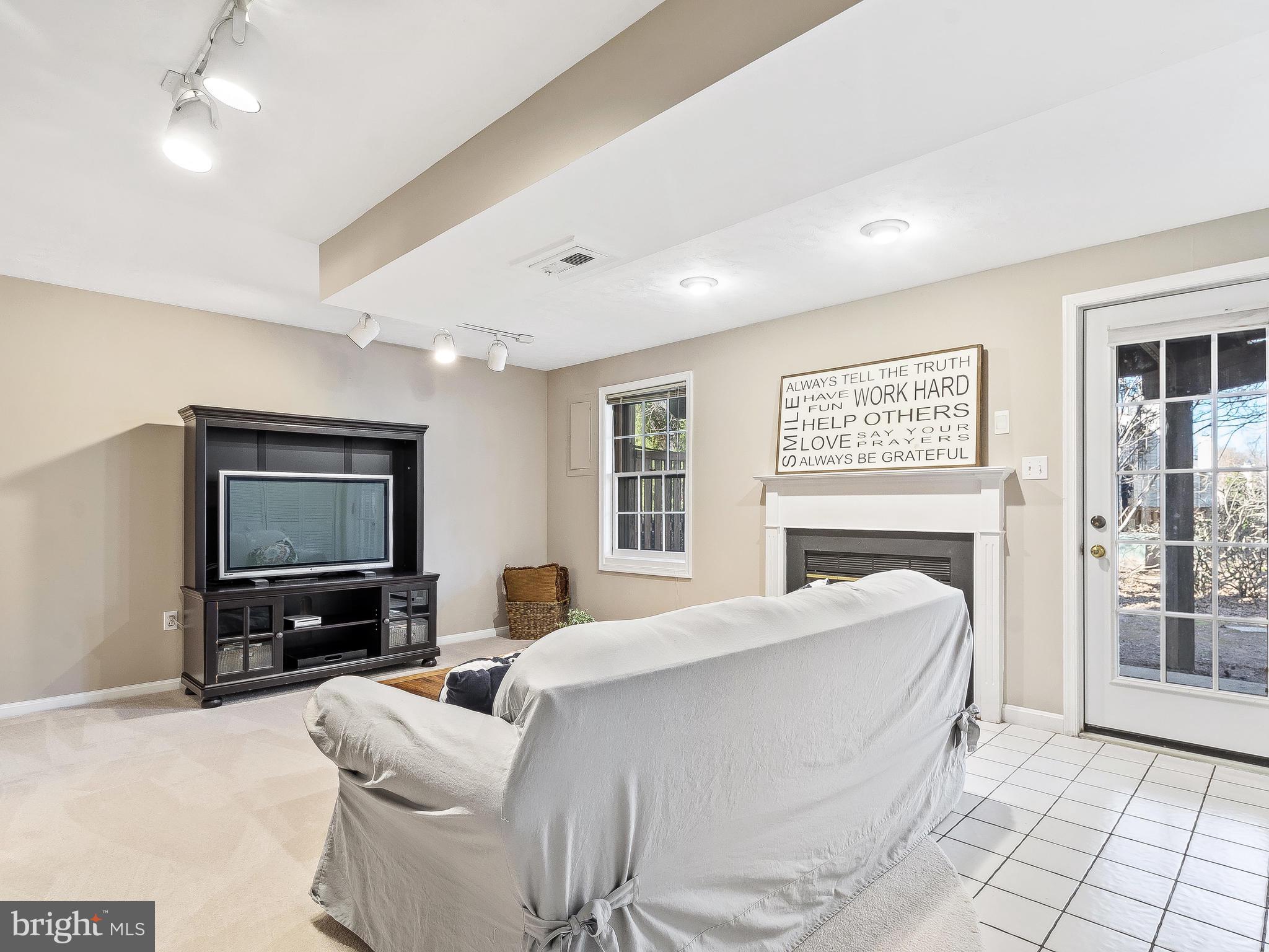 11705 Great Owl Circle Reston, VA 20194 - Photo 28 of 38 Wood burning fireplace & walkout patio