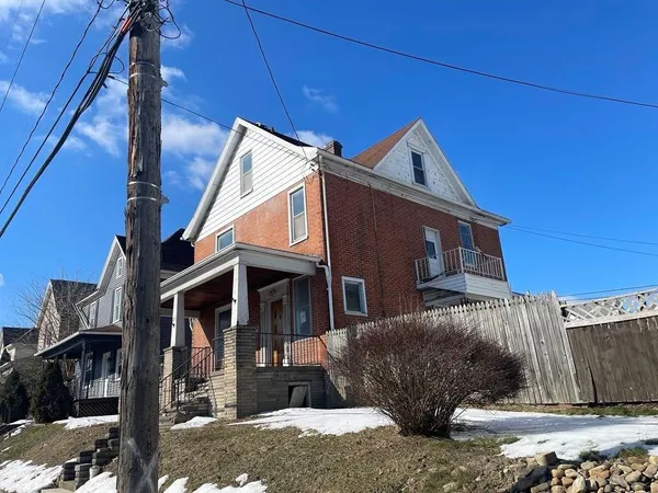 a front view of a house with parking garage