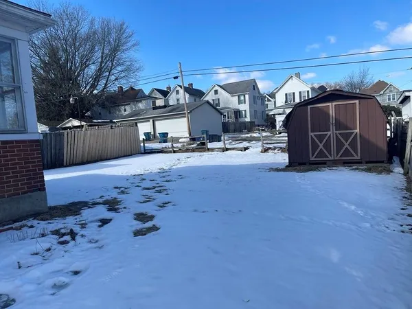 a view of a car park in front of a house