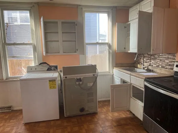 a utility room with washer and dryer