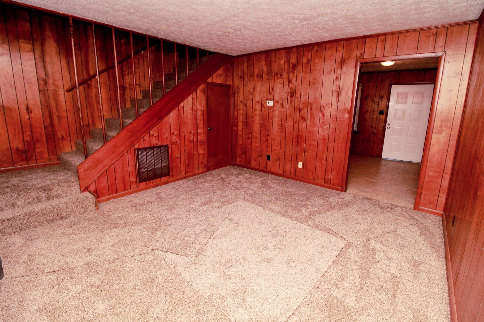 2505 Nelson Drive, Unit F Hopkinsville, KY 42240 - Photo 3 of 7 a view of an empty room with wooden walls