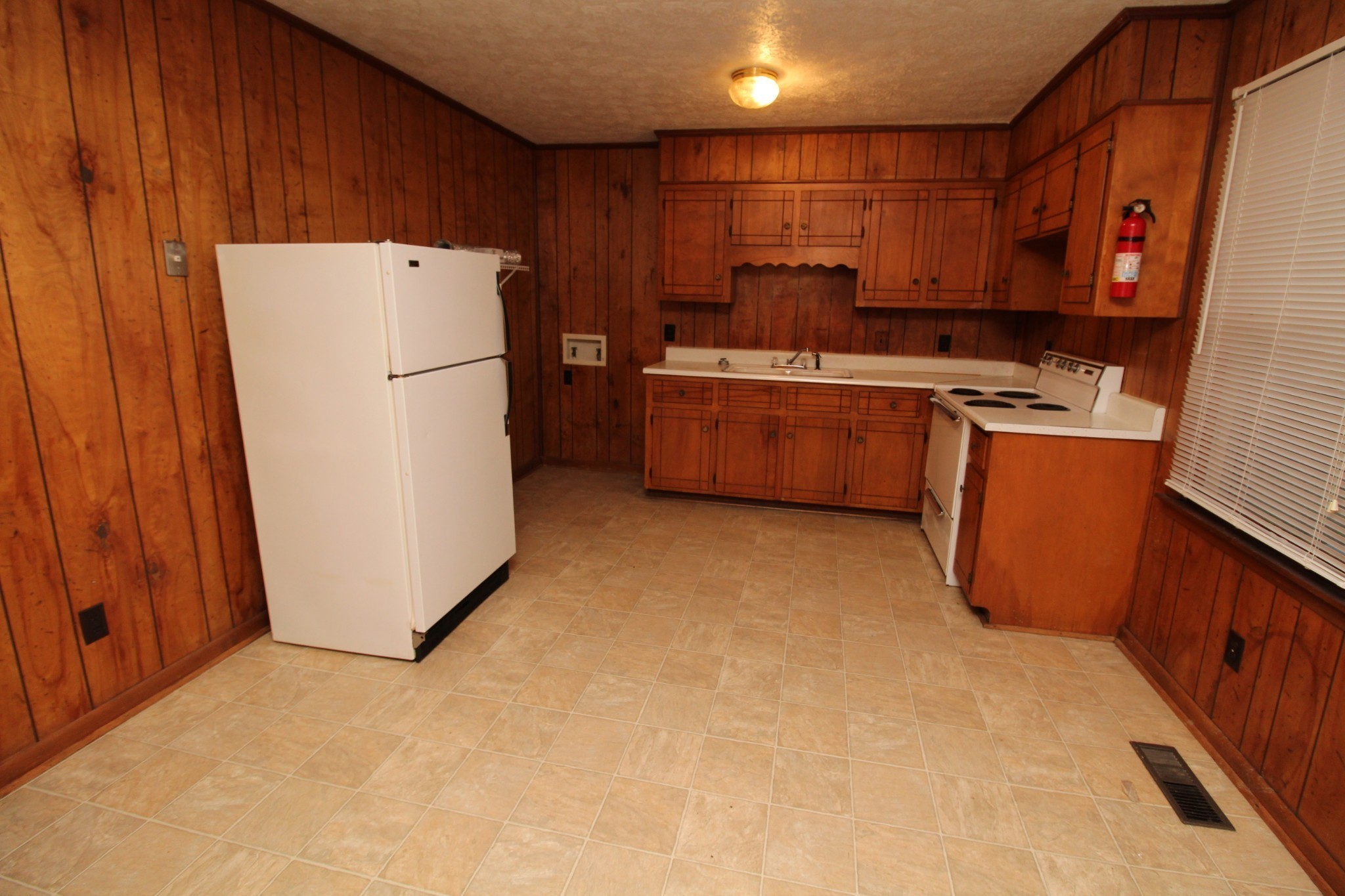 2505 Nelson Drive, Unit F Hopkinsville, KY 42240 - Photo 4 of 7 a kitchen with sink a refrigerator and a stove