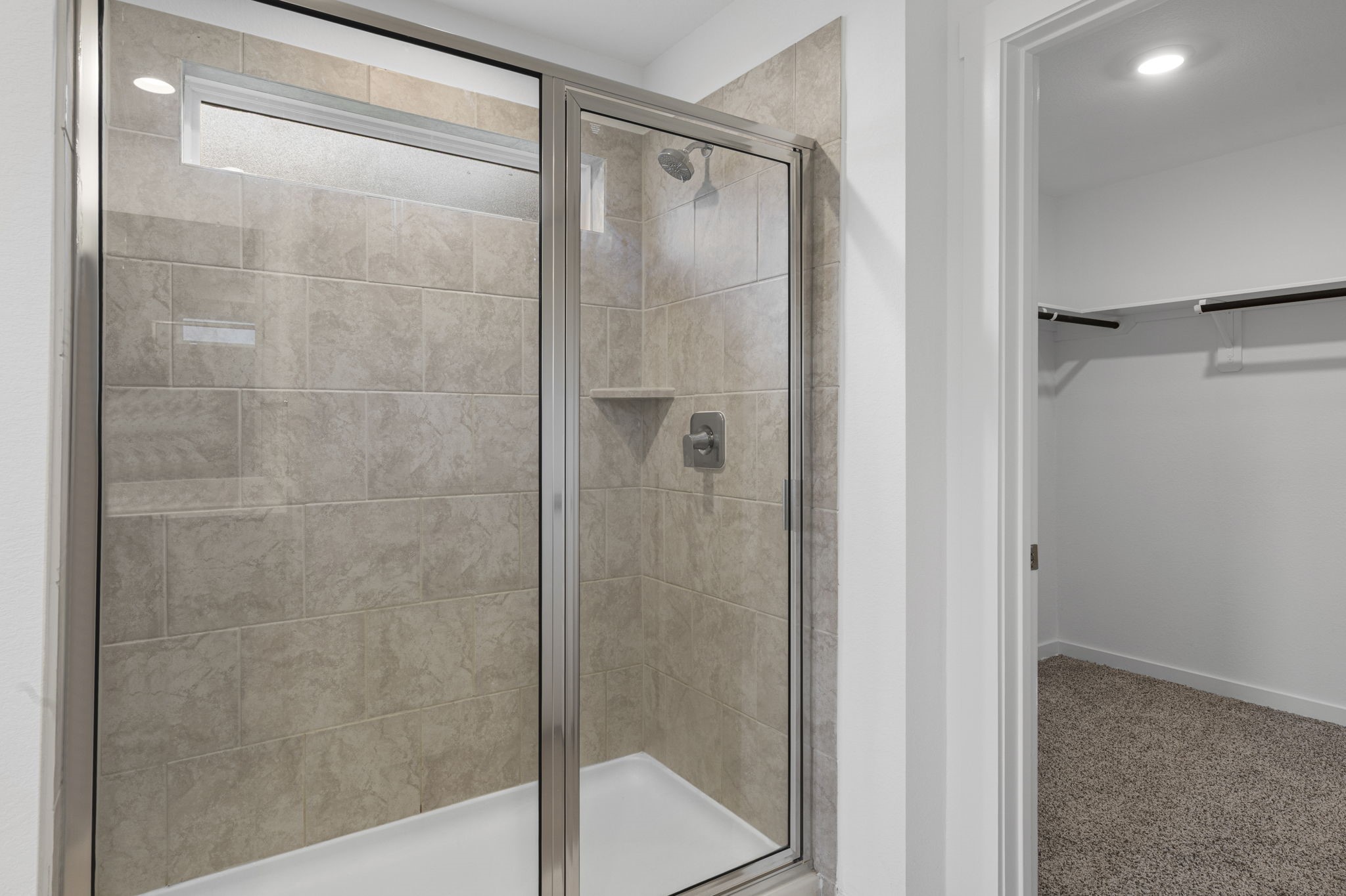 2804 Willow Gulch Way Rosenberg, TX 77469 - Photo 12 of 20 a bathroom with a glass shower door