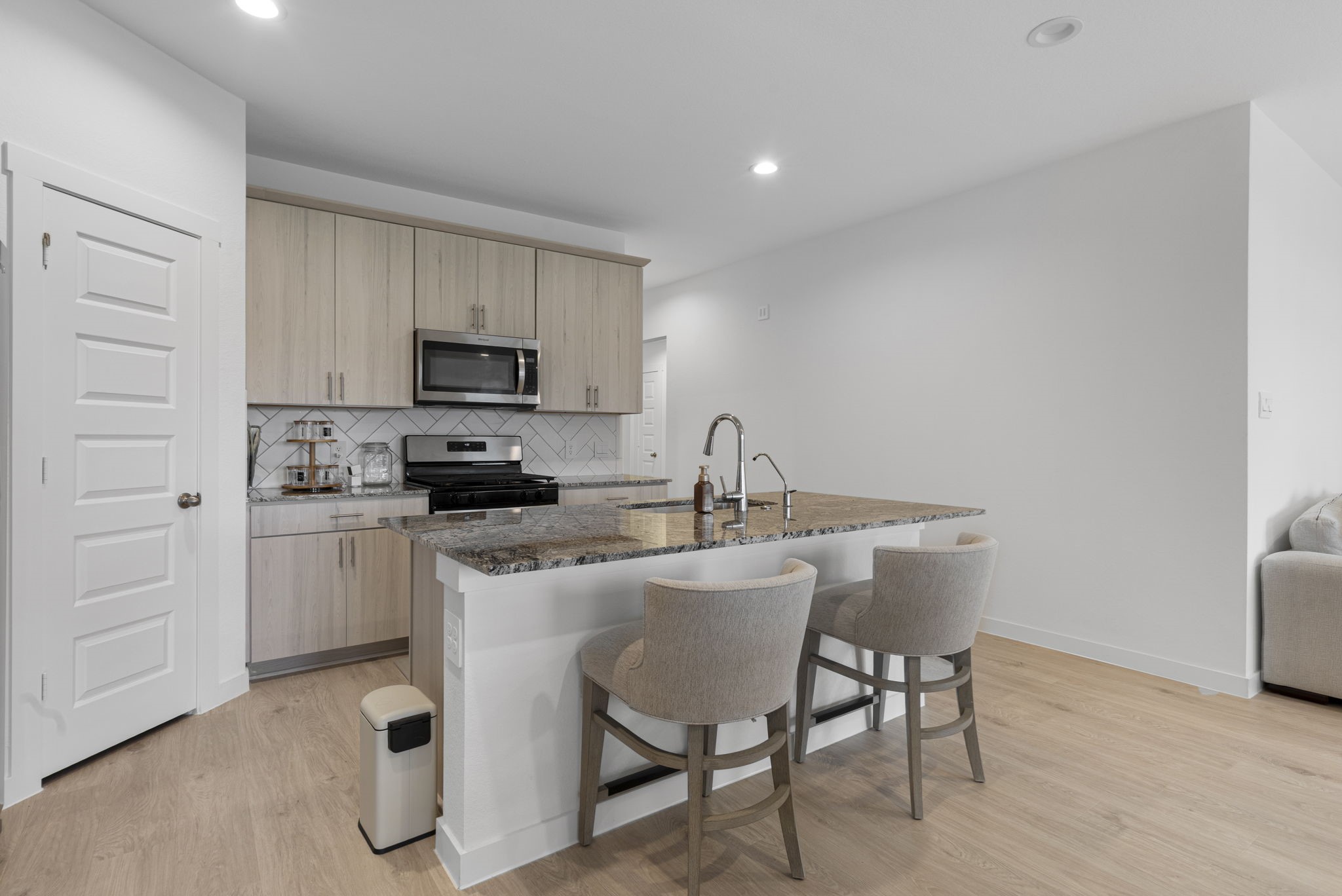 2804 Willow Gulch Way Rosenberg, TX 77469 - Photo 2 of 20 a kitchen with a sink cabinets and wooden floor