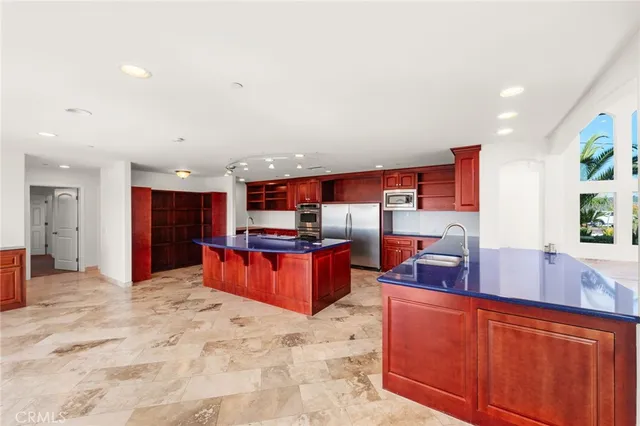 a view of a living room kitchen and a window